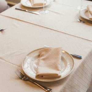 Clever cleaning hack for removing a stain from a linen tablecloth.