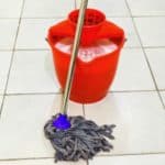 My favorite tip for cleaning kitchen floors by mopping with vinegar. One of my favorite kitchen floor cleaning hacks!