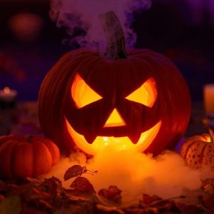 Fog pouring from a carved pumpkin filled with dry ice and water