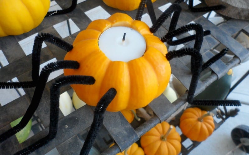 Easy pumpkin spider candle holders to make for your front porch for Halloween.