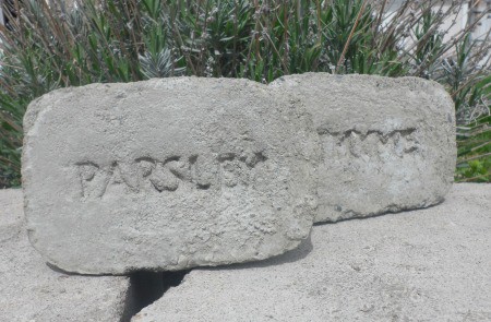 Easy DIY plant marker made of concrete for your herb garden.