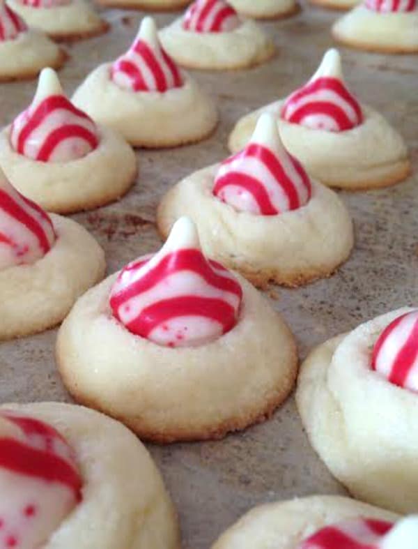Easy recipe for candy cane kiss cookies. One of my favorite holiday cookie recipes for Christmas cookie exchanges and to give away as holiday treats.
