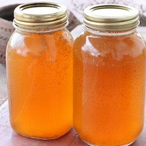 Recipe for canning the best homemade chicken broth or stock, including a step by step video if you are new to pressure canning.
