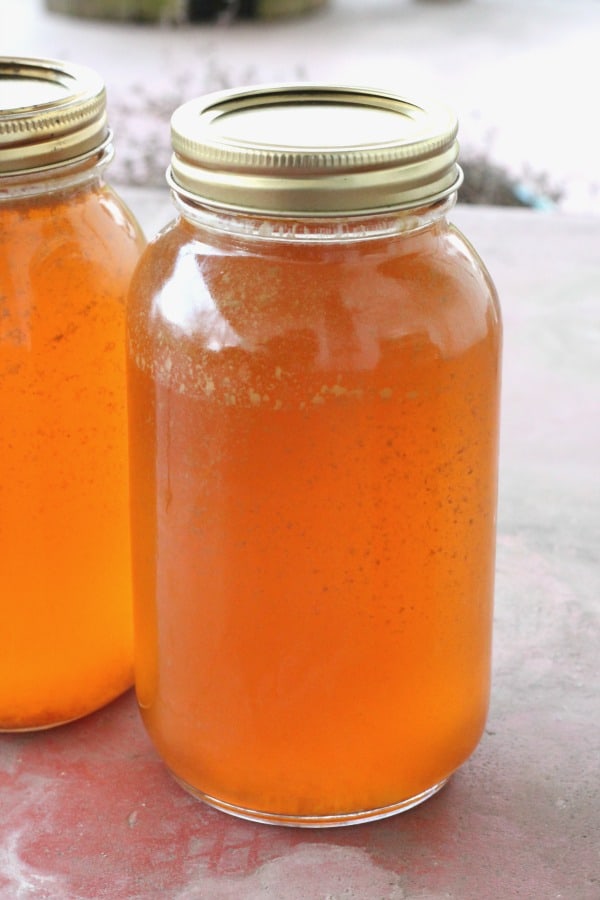 Two jars of homemade canned chicken broth