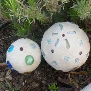 An easy weekend project, these DIY garden globes look like they are made out of concrete.