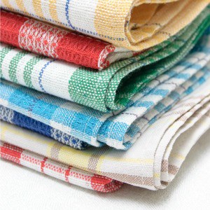 Clever cleaning hacks for washing new kitchen towels, how to get stains out of towels, and how to clean greasy kitchen towels.