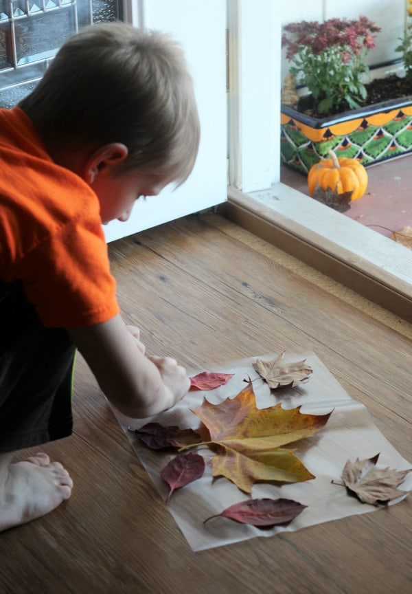 Placemats made from fall leaves are a fun Thanksgiving craft activity for preschool and kids of all ages.