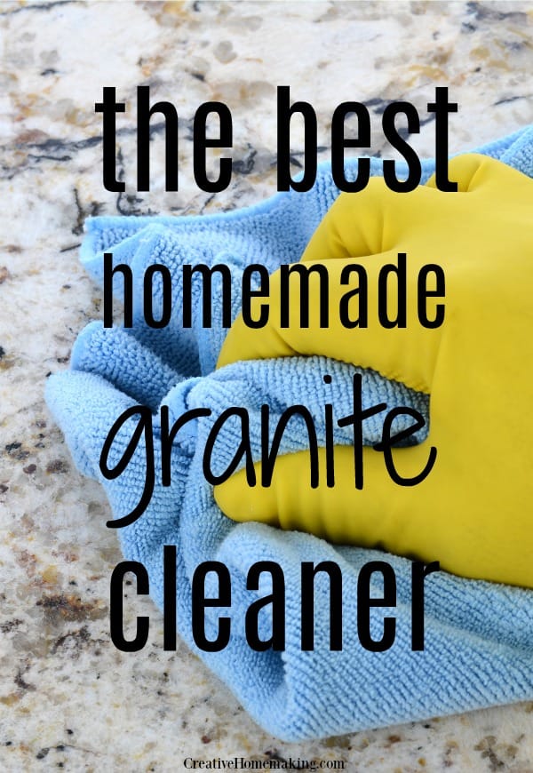 Photo of person cleaning a granite kitchen countertop