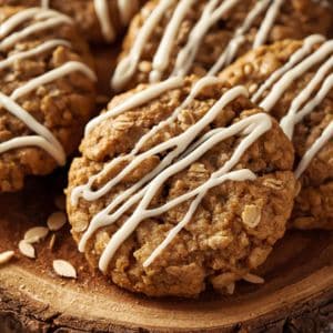 Plate of iced oatmeal cookies with red and green frosting on a holiday table