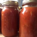 Extra tomatoes from your garden? Try making and canning homemade spaghetti sauce.