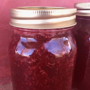 Easy step-by-step instructions for making and canning strawberry rhubarb jam from fresh strawberries and rhubarb from the garden.