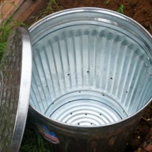 Tips for making your own backyard composter from a galvanized metal garbage can.