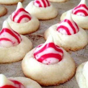 These peppermint candy kiss cookies are a fun holiday variation of Hershey's chocolate kiss cookies.