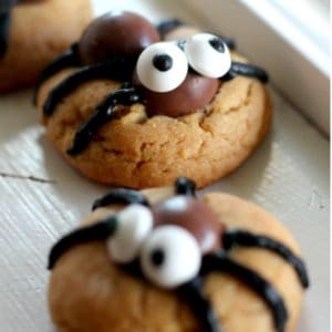 These spider cookies are an easy fun treat for kids for Halloween. Let your kids or grandkids get in on the fun and let them help decorate them!