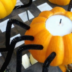 Easy pumpkin spider candle holders to make for your front porch for Halloween.
