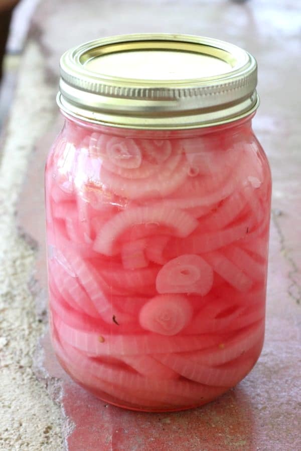 Easy recipe for canning pickled red onions to enjoy in salads an on sandwiches all year round.