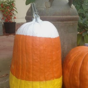 Easy candy corn pumpkin you can paint to decorate your front porch for fall or Halloween.