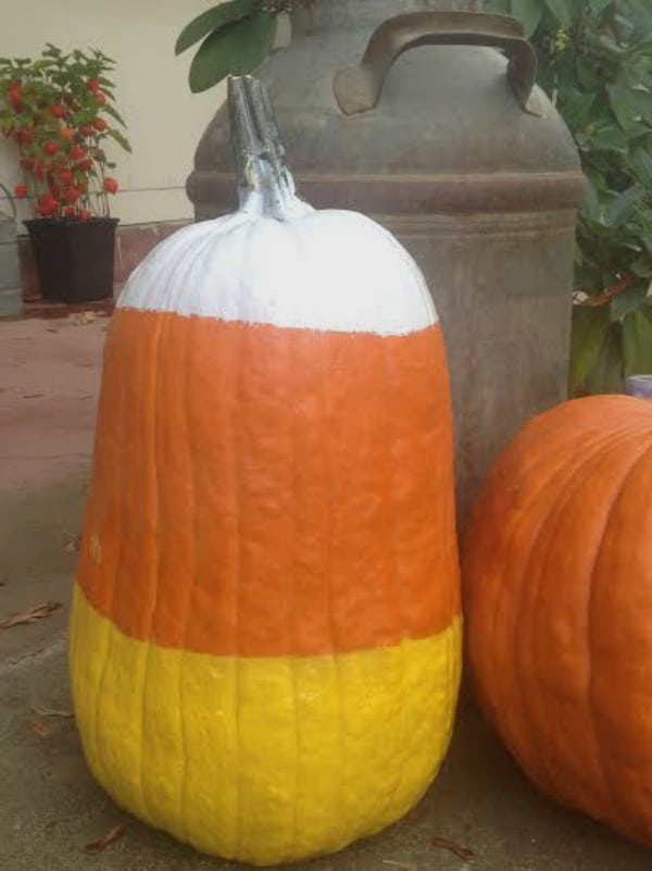 Easy candy corn pumpkin you can paint to decorate your front porch for fall or Halloween.