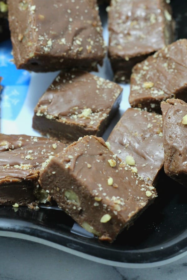 Easy three ingredient fudge recipe made with sweetened condensed milk, chocolate chips, and nuts. One of my favorite quick easy holiday desserts.