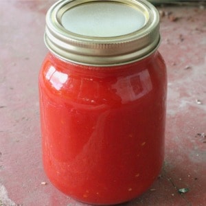 How to can tomato sauce. Learn the easy way to make the BEST tomato sauce from fresh tomatoes using a water bath canner. Easy canning recipe for beginners.