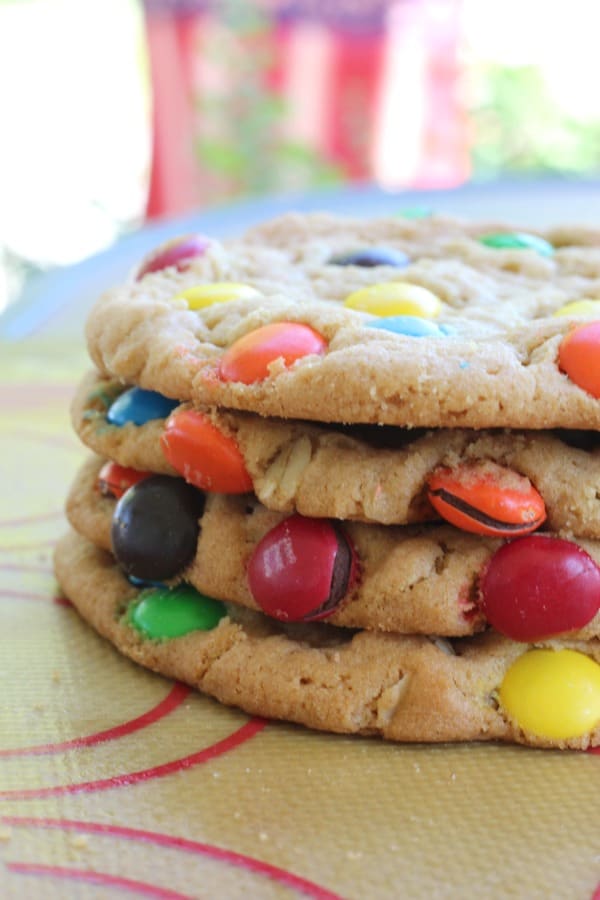 The BEST giant soft M&M cookie recipe. A secret ingredient makes them turn out perfect every time. My favorite giant cookie recipe!