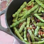 My favorite recipe for easy sauteed green beans with bacon and onions, a great vegetable side dish to serve with chicken, steak, or pork.