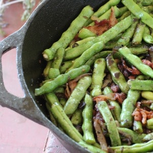 My favorite recipe for easy sauteed green beans with bacon and onions, a great vegetable side dish to serve with chicken, steak, or pork.