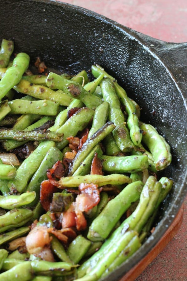 My favorite recipe for easy sauteed green beans with bacon and onions, a great vegetable side dish to serve with chicken, steak, or pork.