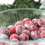 Easy frosted cranberries recipe to make for Christmas. These sugared cranberries are a tasty holiday treat. Use them to decorate your holiday table!