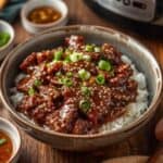 Slow Cooker Mongolian Beef with green onions and sesame seeds – tender Asian food dish