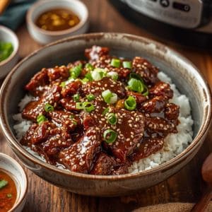 Slow Cooker Mongolian Beef with green onions and sesame seeds – tender Asian food dish
