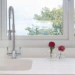 Close-up of a shiny, spotless kitchen sink after cleaning