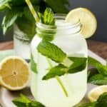 Homemade mint lemonade served in a mason jar with a straw and mint garnish