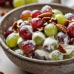 Close-up of creamy grape salad with brown sugar and pecans on top