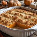 Baked butternut squash casserole with golden breadcrumb topping