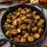 Roasted Brussels sprouts drizzled with maple glaze on a serving platter