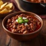 Rustic pot of chili served with cornbread, fall food idea