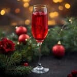Sparkling poinsettia cocktail with cranberry and champagne for Christmas celebrations