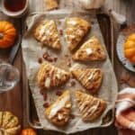 Freshly baked pumpkin scones on a rustic fall table