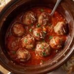 Hearty slow cooker Italian meatballs simmering in tomato sauce