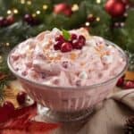Bowl of creamy cranberry fluff salad with marshmallows and pineapple