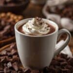 Steaming cup of French hot chocolate on a wooden table