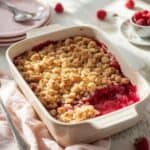 Raspberry crumble served warm with spoon for brunch